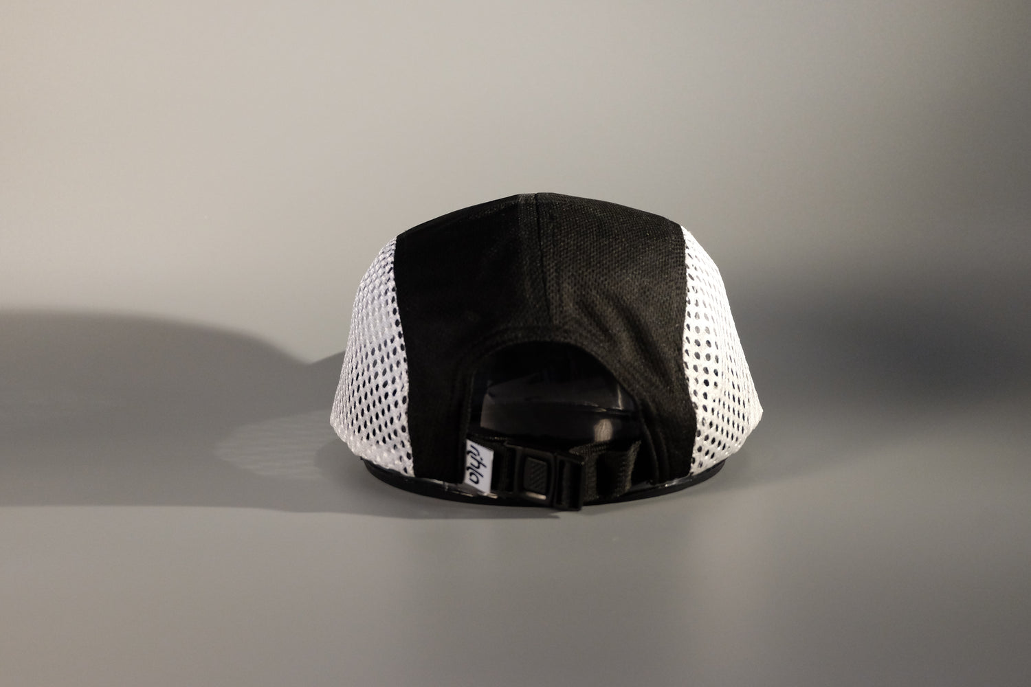 rihla black and white running cap - back of cap